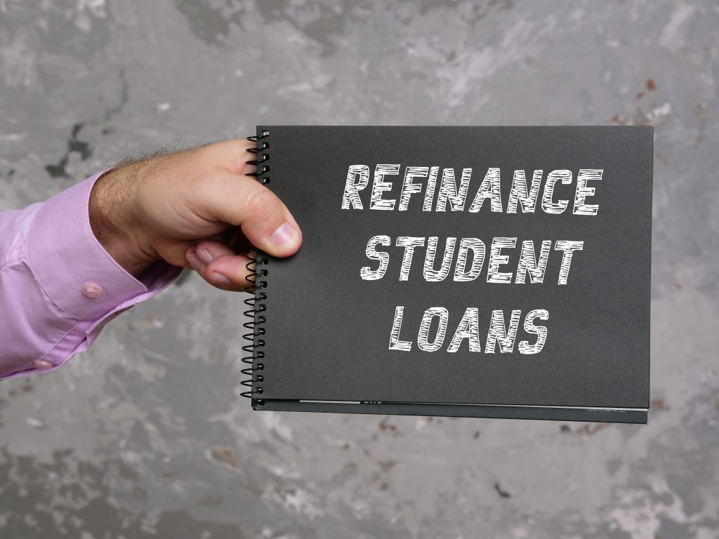 Business concept about REFINANCE STUDENT LOANS with the phrase on the sheet.